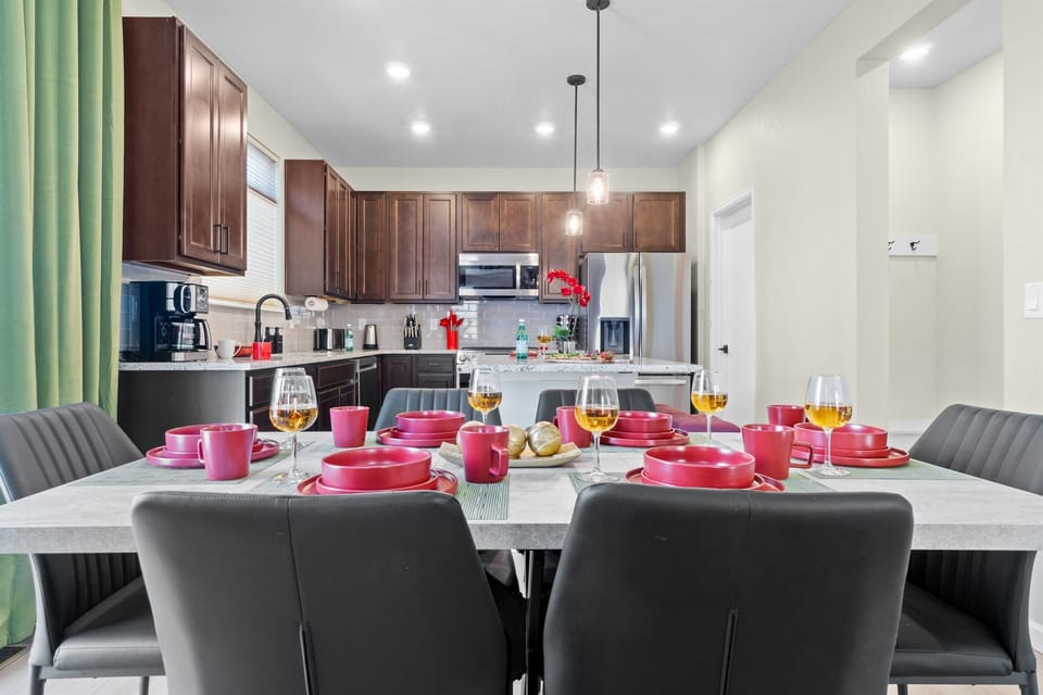 Spacious kitchen equipped with modern stainless steel appliances, perfect for cooking and entertaining.