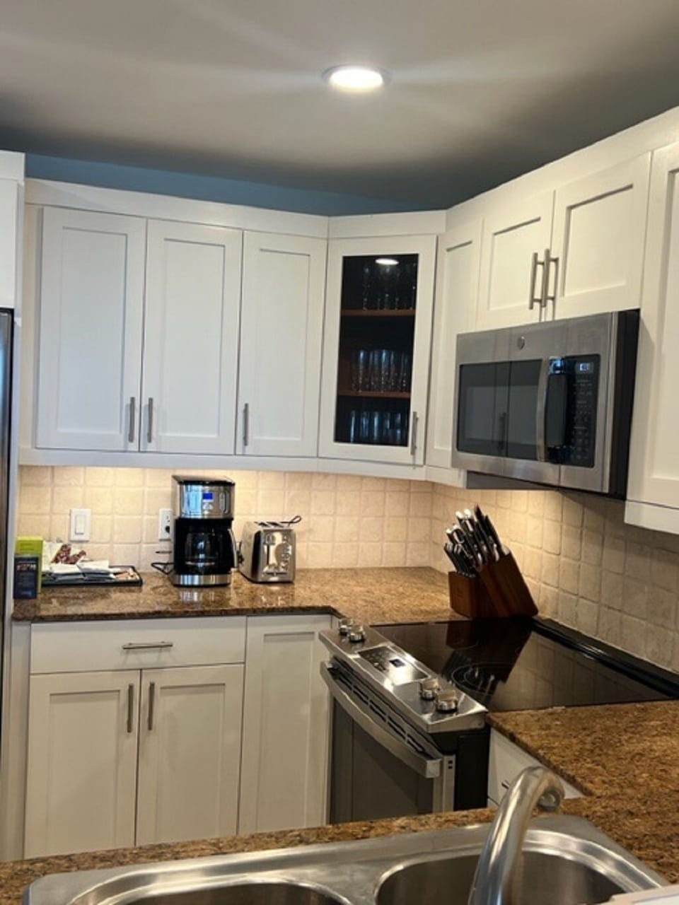 Kitchen with granite countertops and stainless steel appliances