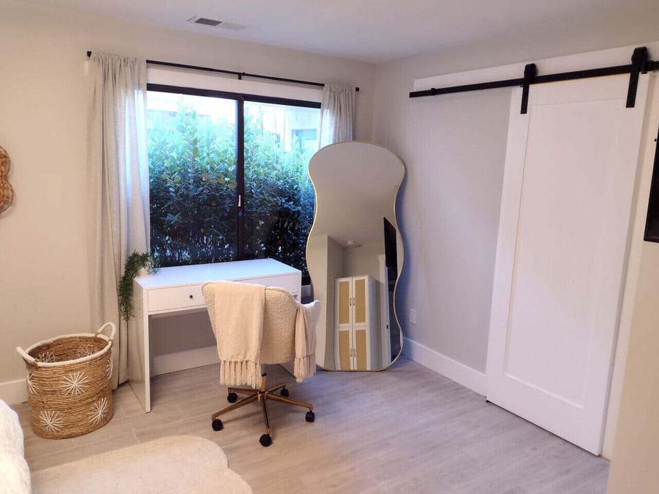 Master bedroom with desk and comfortable office chair