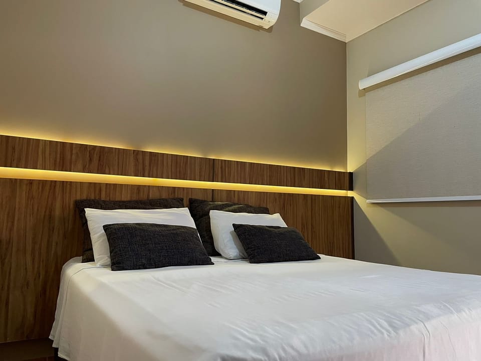 Apartamento Superior Térreo | Minibar, soundproofing, iron/ironing board, travel crib