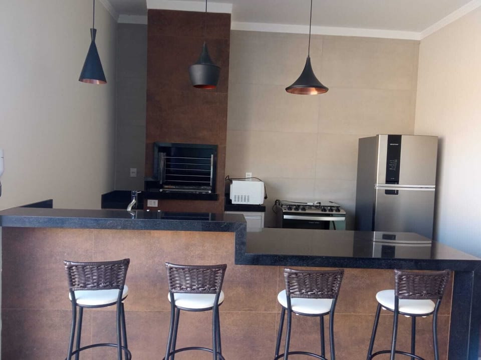 Casa na Cidade a 5km do Hotel - P/12 pessoas | Minibar, soundproofing, iron/ironing board, travel crib