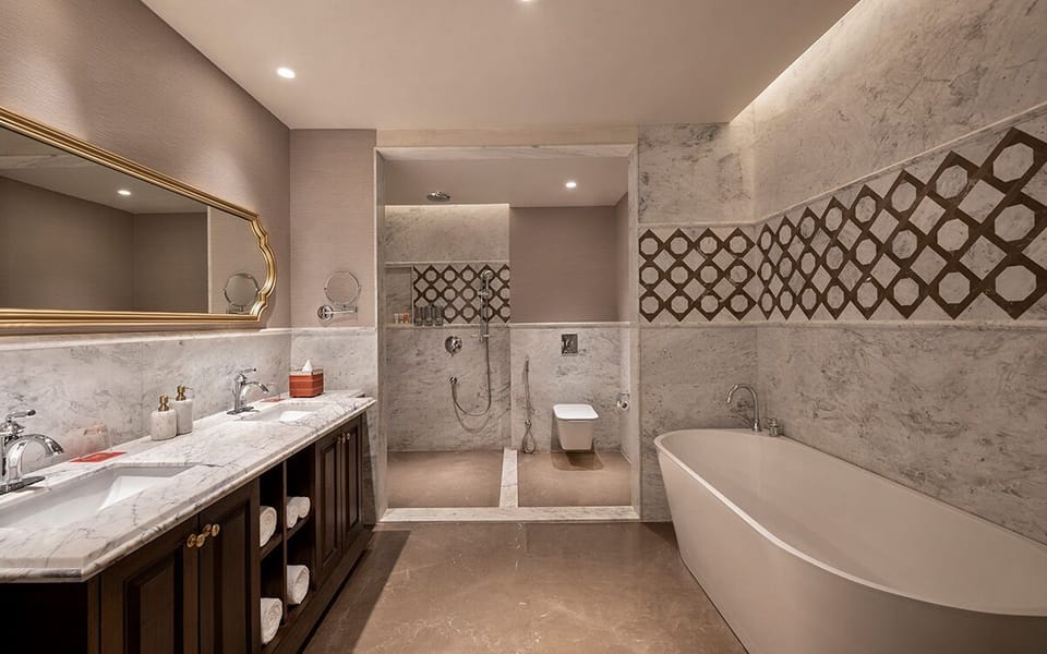 Suite, 1 King Bed (Luxury Suite) | Bathroom | Hair dryer, slippers, towels, soap