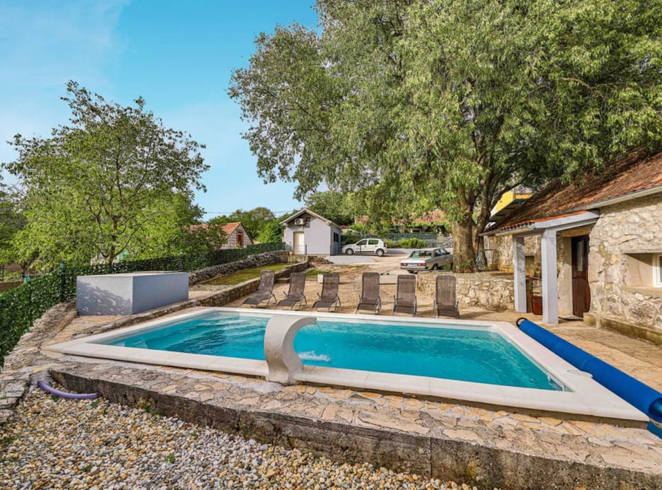 House (Three Bedroom Holiday Home with Pool) | Outdoor pool | Outdoor pool, a heated pool, sun loungers