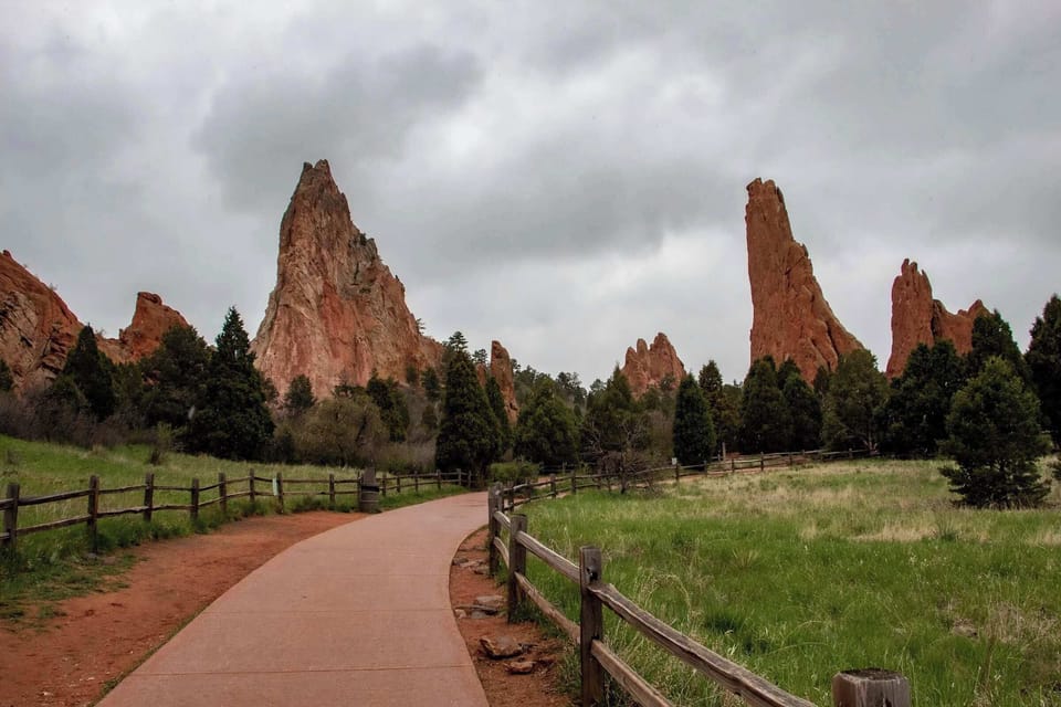 300-million-year-old red sandstone formations rising against Pikes Peak, completely free to visit. Hike, drive through, or just pull over and stare. It never loses its effect no matter how many times you go.