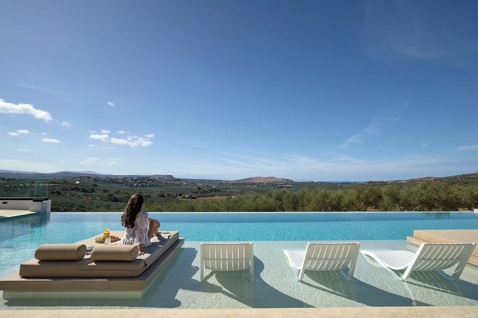 The pool's built-in sunbeds, perfect for lounging under the Greek sun.