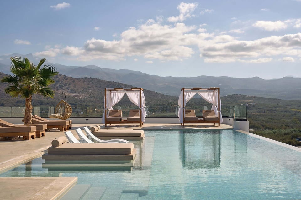 Refresh in the crystal-clear waters of the expansive infinity pool.