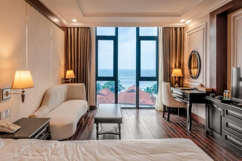 Deluxe Double Room, Sea View | Minibar, desk, laptop workspace, blackout drapes