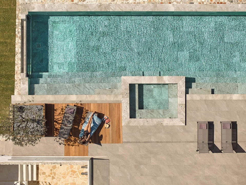 The pool terrace is equipped with high quality sun beds and umbrellas. 
