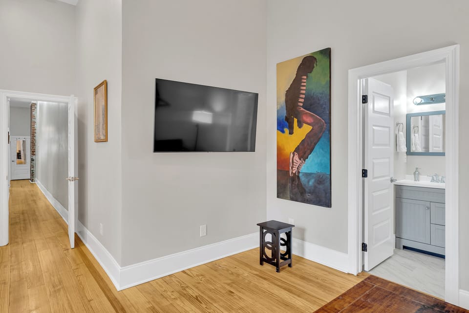 Unwind with your favorite shows or enjoy the artistic ambiance that celebrates music and culture in this inviting space.