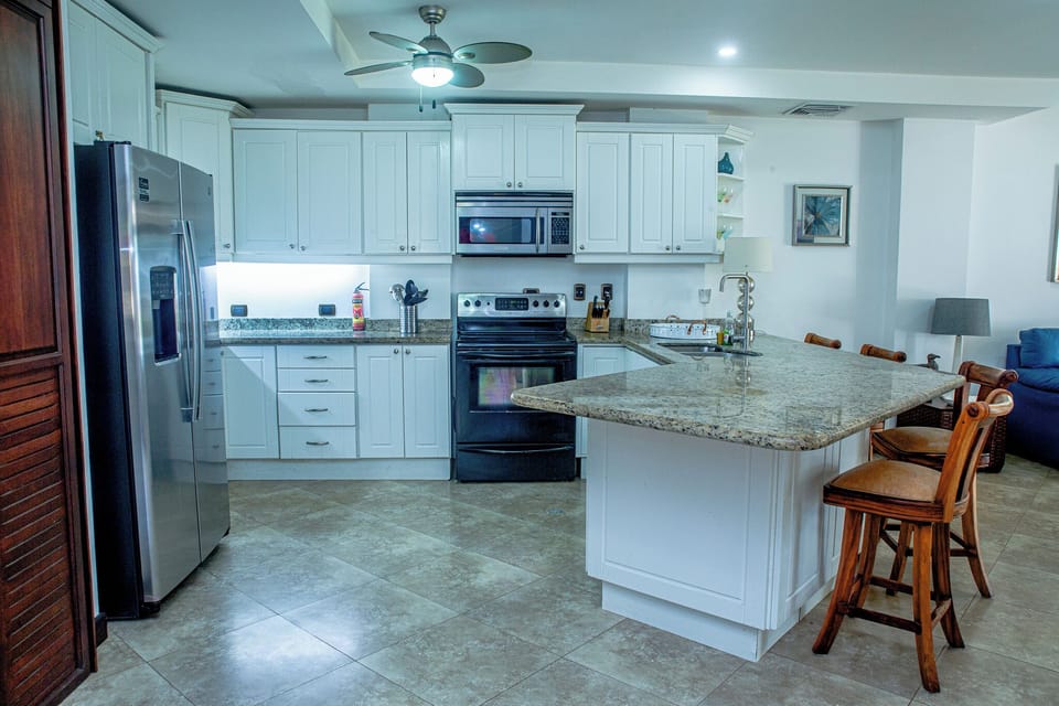 Spacious kitchen with a central island and modern appliances.
