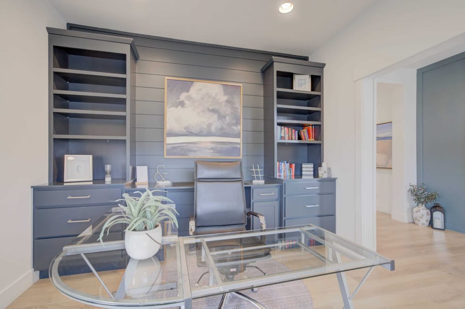 Work Station: Enjoy a peaceful work setting with our modern glass desk and comfortable leather chair, designed for productivity.