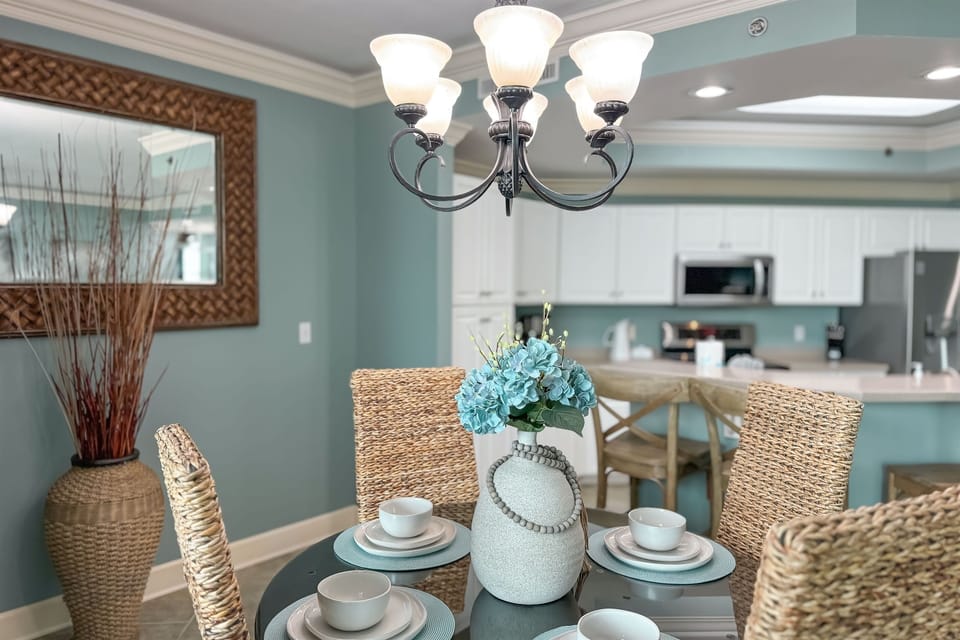 This inviting dining area features comfortable seating and a stylish setting, ideal for both casual and formal occasions.