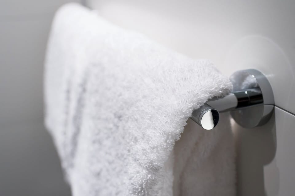 Shower, hair dryer, towels, shampoo