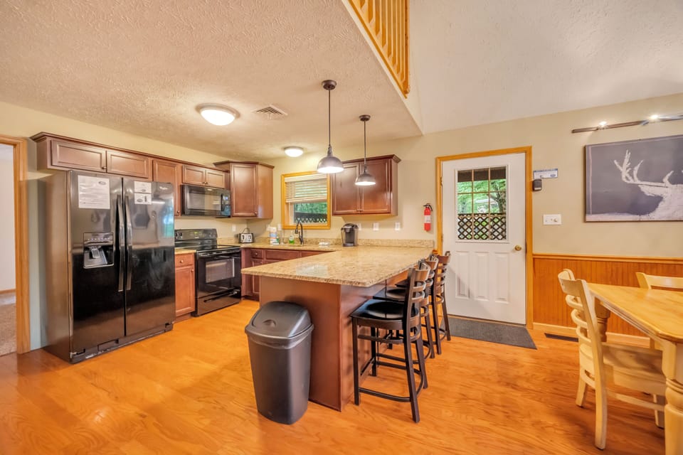 Release Your Inner Chef in the Modern Kitchen with Additional Seating at the Breakfast Bar