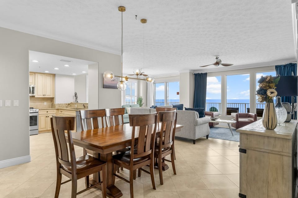 Spacious dining area with ocean views and modern decor.