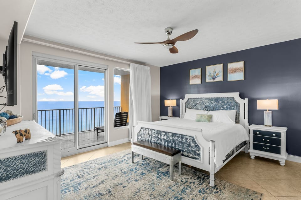 Relax in this coastal bedroom with ocean views and modern decor.