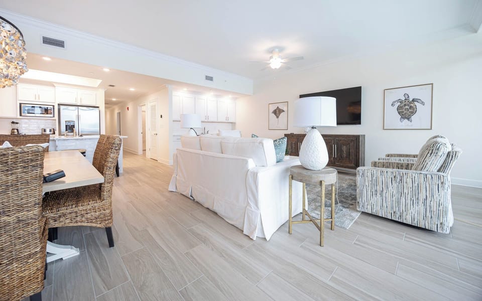 Gather in this welcoming living space and enjoy stunning beach views through the windows