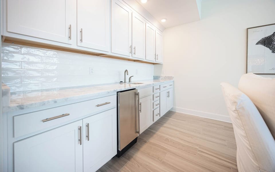 Grab a chilled drink from the fridge or create your favorite cocktail at the wet bar