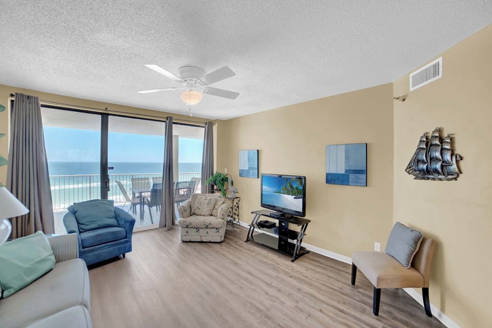 Living room with flat-screen TV and private balcony access
