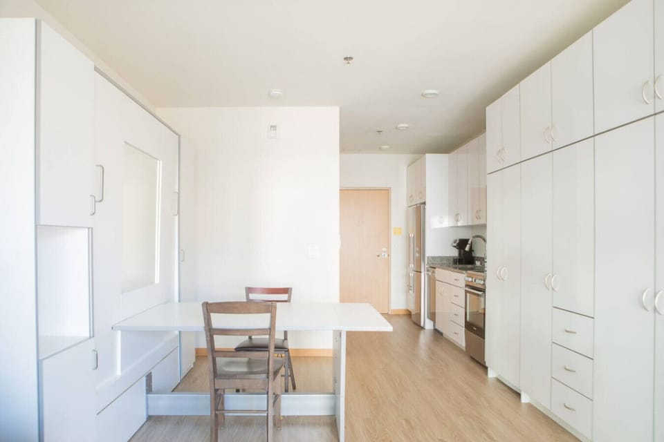 Smartly designed Murphy bed transforms the space in seconds—enjoy a comfortable night’s sleep without sacrificing daytime living space