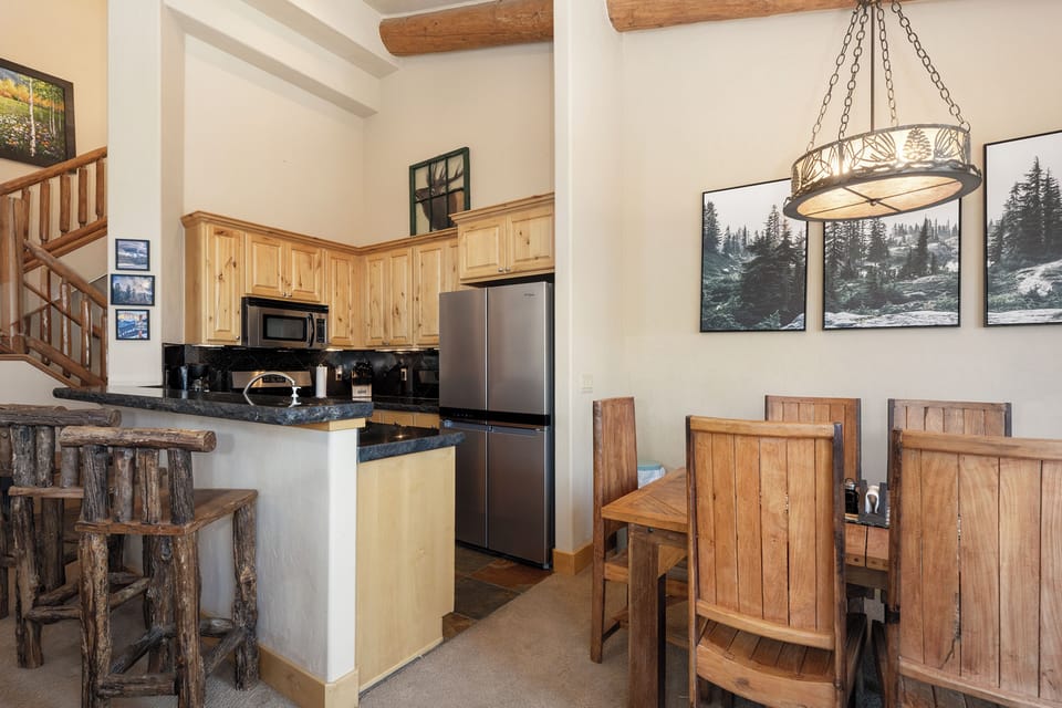 - Kitchen and dining space with rustic wooden style   - Stainless steel appliances with full cooking setup   - Perfect for ski meals and après ski gatherings