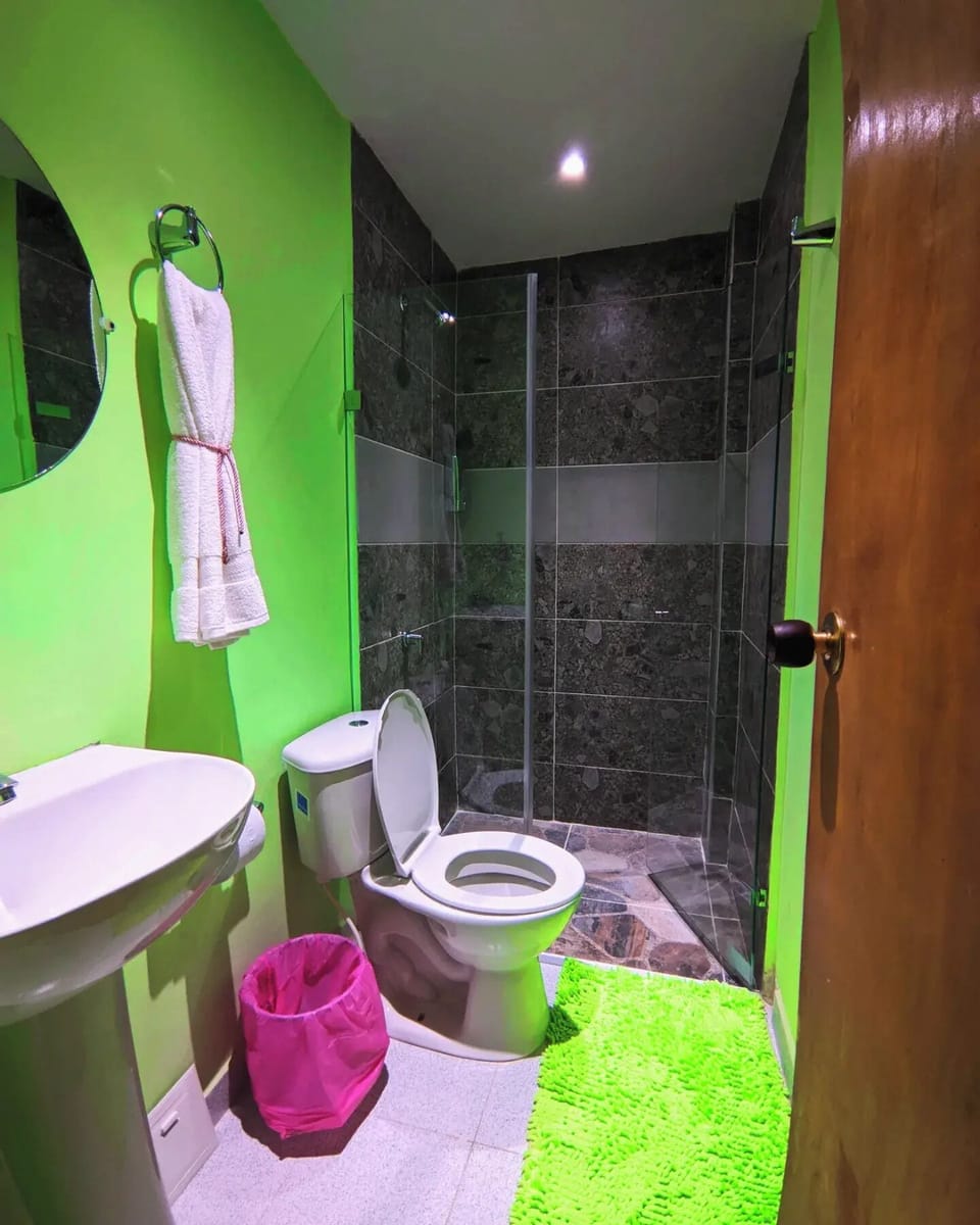 Deluxe Double Room, Balcony, Beach View | Bathroom | Shower, rainfall showerhead, towels, soap