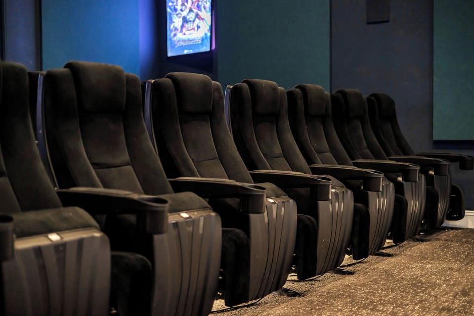 Private theater with recliners and large-screen Netflix streaming.