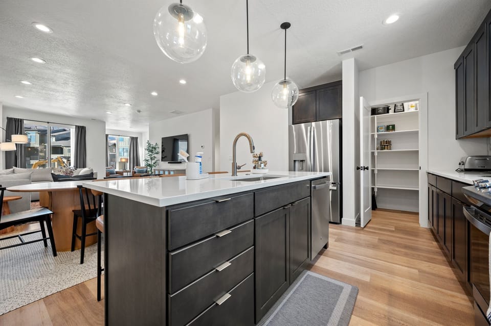 Open concept design from kitchen, dining area, to living room.