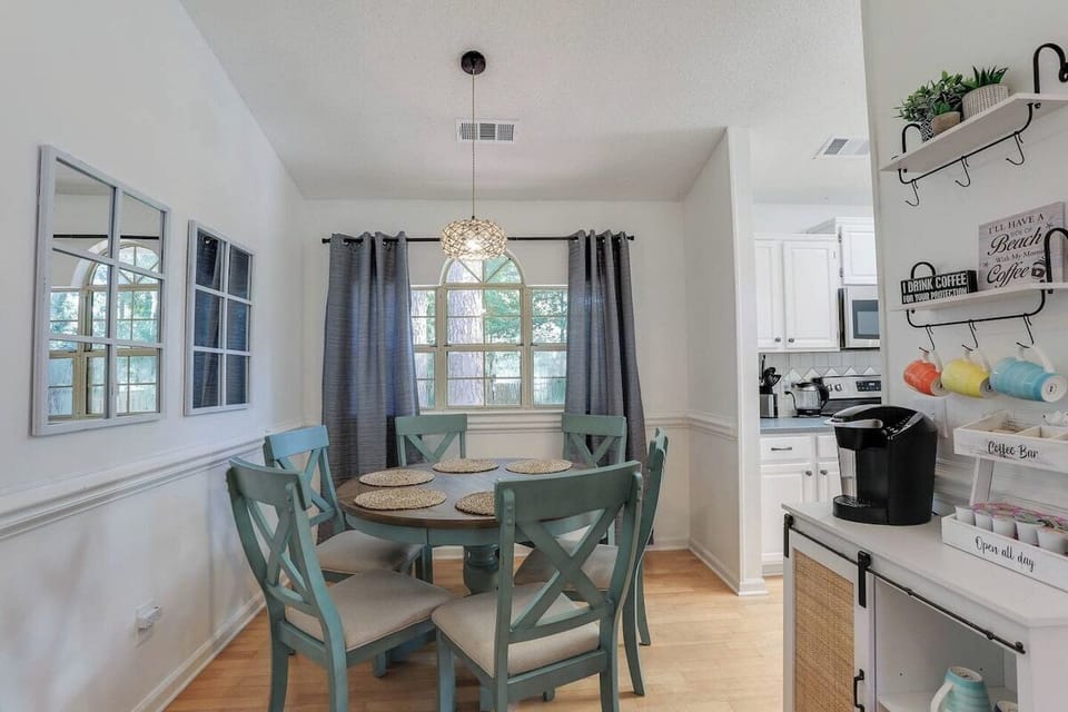 Gather around the dining table with seating for six, perfect for shared meals and memorable conversations.