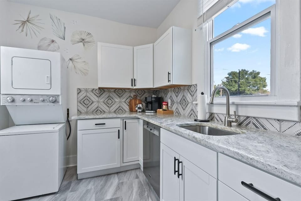 The fully equipped kitchen features a gas range and sleek stainless steel appliances, ready for creating delicious meals and memorable moments. ️✨