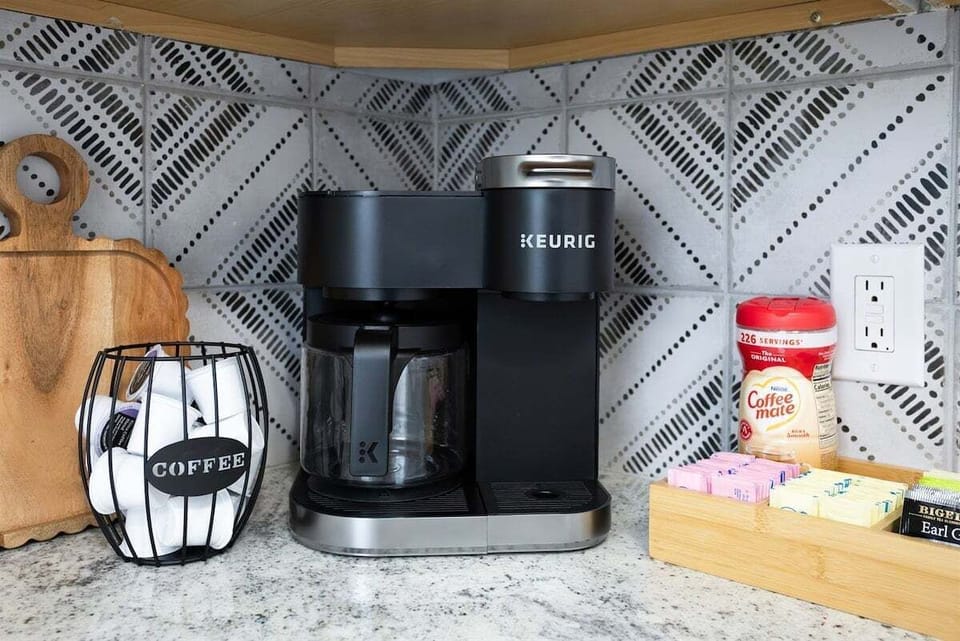 Start your day at the fully stocked coffee bar, complete with coffee, tea, creamer, and sugar—everything you need for the perfect morning pick-me-up. ☕