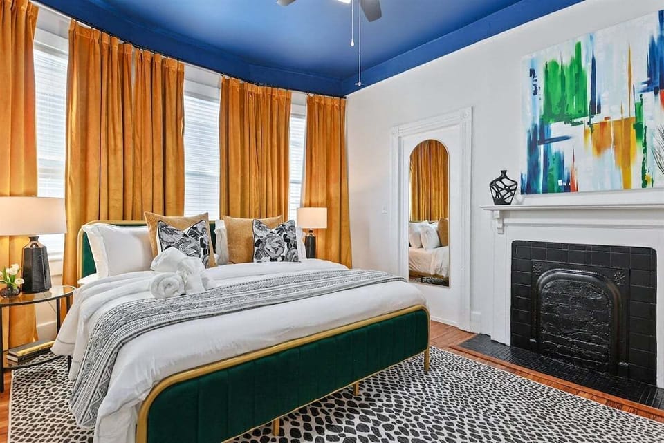 Nestled at the heart of The Manor, the Hearth Room offers a cozy retreat with a king bed, extra pillows, a soft blanket, and a smart TV—everything you need to unwind in comfort.