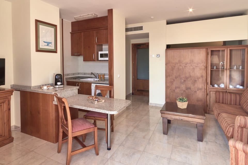 Family Apartment, Sea View | Private kitchen | Coffee/tea maker, highchair