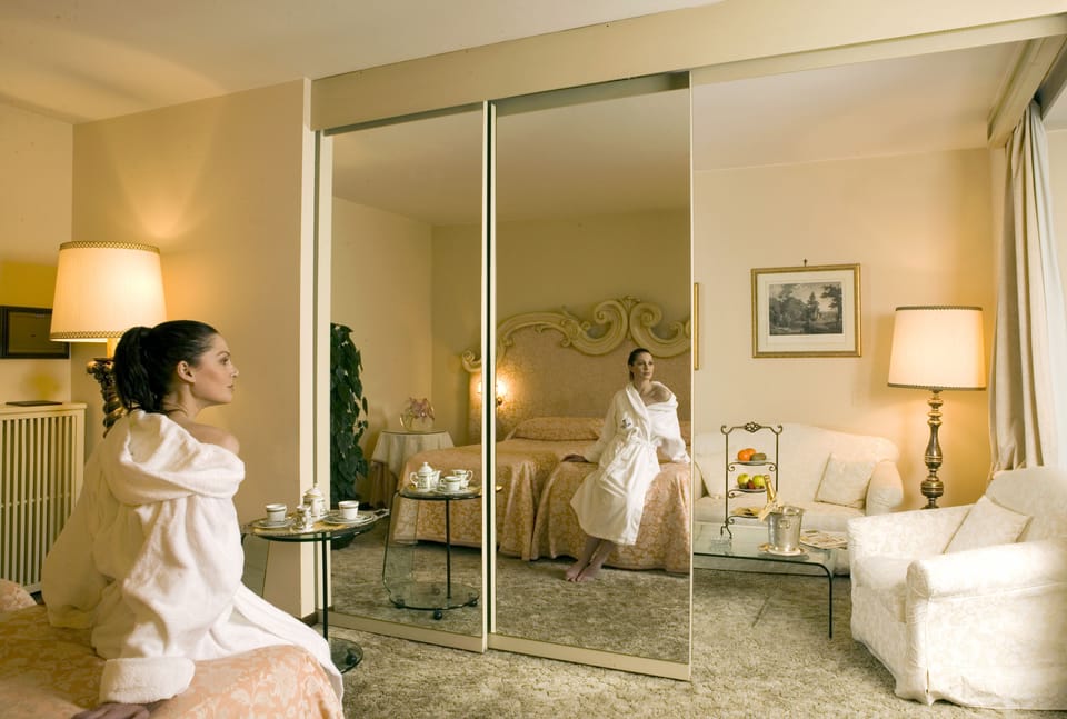 Deluxe Double or Twin Room | Living area | TV
