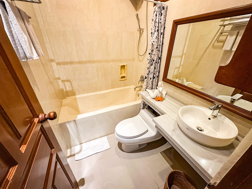 Double or Twin Room, Garden View | Bathroom | Combined shower/tub, bidet, towels, soap
