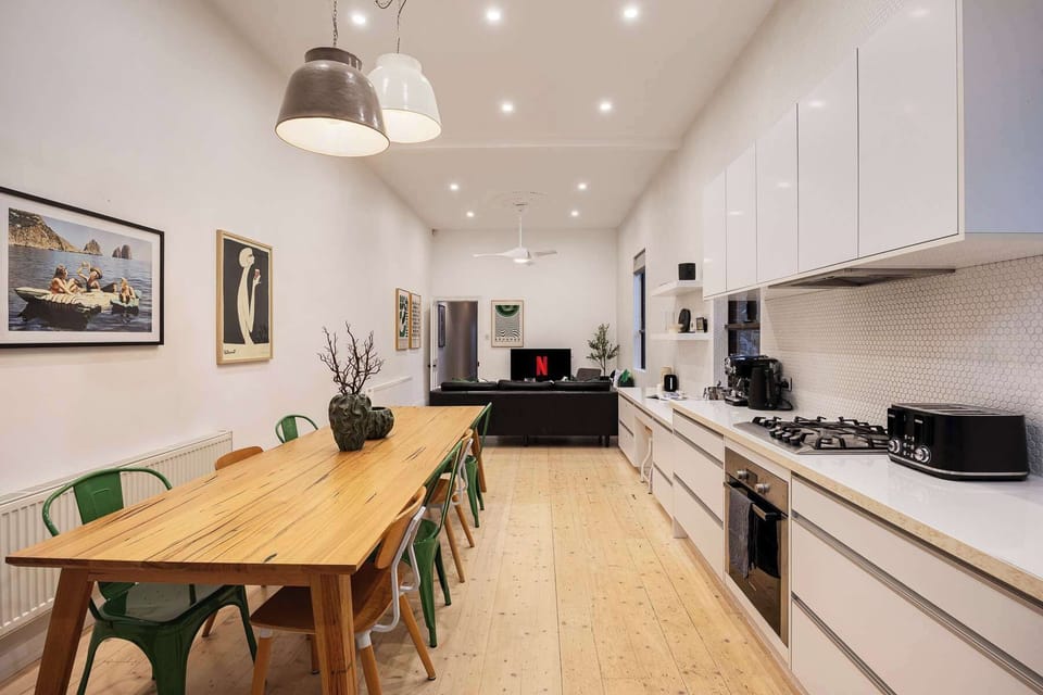 Dining area, kitchen and living room.