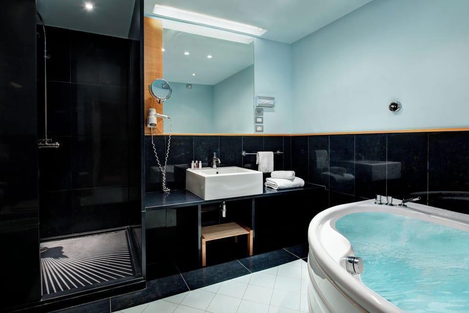 Superior Double or Twin Room, 1 Double Bed, Partial Sea View | Bathroom | Combined shower/tub, free toiletries, hair dryer, slippers