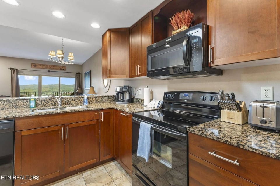Fully equipped kitchen with all your major appliances. Stove, dishwasher, microwave, and refrigerator.