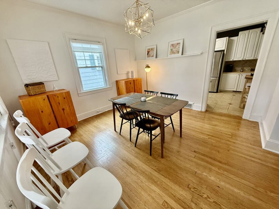 Dining table to seat 4 with extra chairs available. Located between the living room and kitchen.
