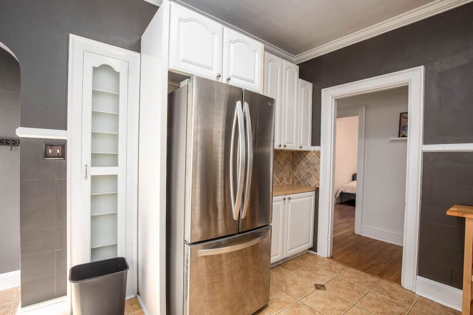 Full size refrigerator with pull out freezer