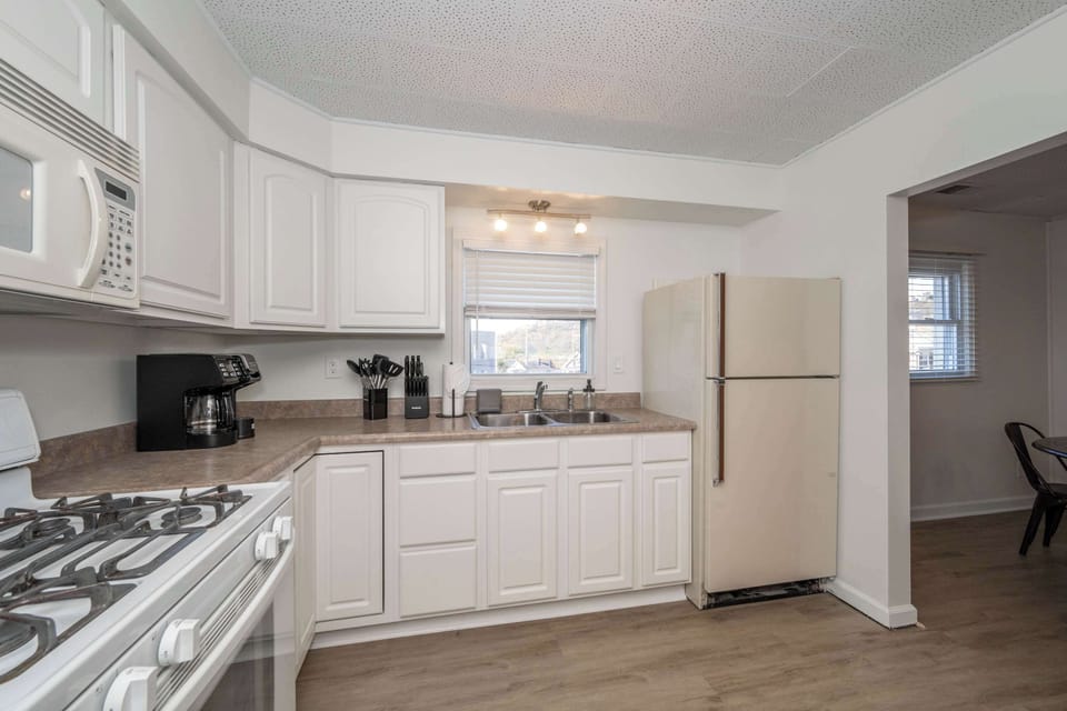 The kitchen is stocked with ample amenities for an unforgettable getaway