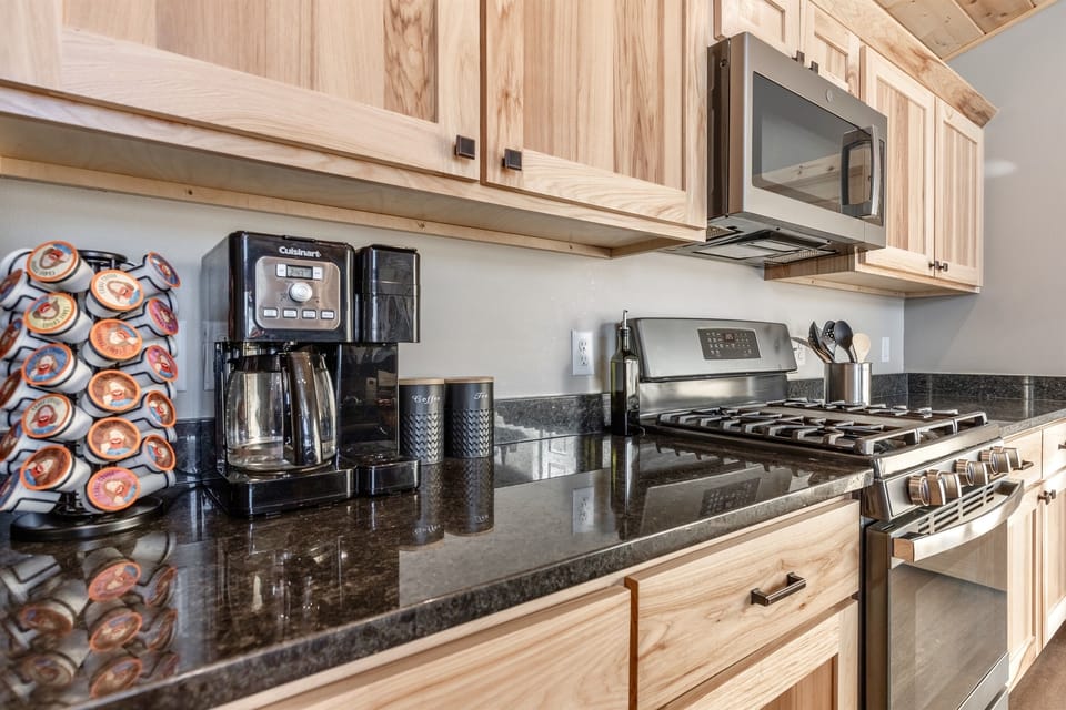 Kitchen equipped with coffee, tea, and coffee pods.  We have basic salt, pepper and olive oil as well.  All utensils, plates, bowls, glassware, crockpot and much more.