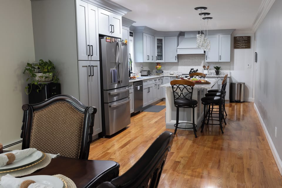 Open concept Kitchen + Dining + Living space. 

Island seats 4
Dining table 6-8 