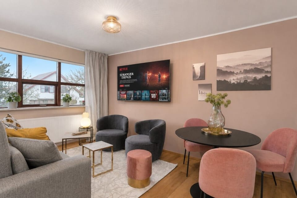 The living area is directly connected to the dining area, creating an open, fluid space that`s perfect for entertaining and family gatherings.
