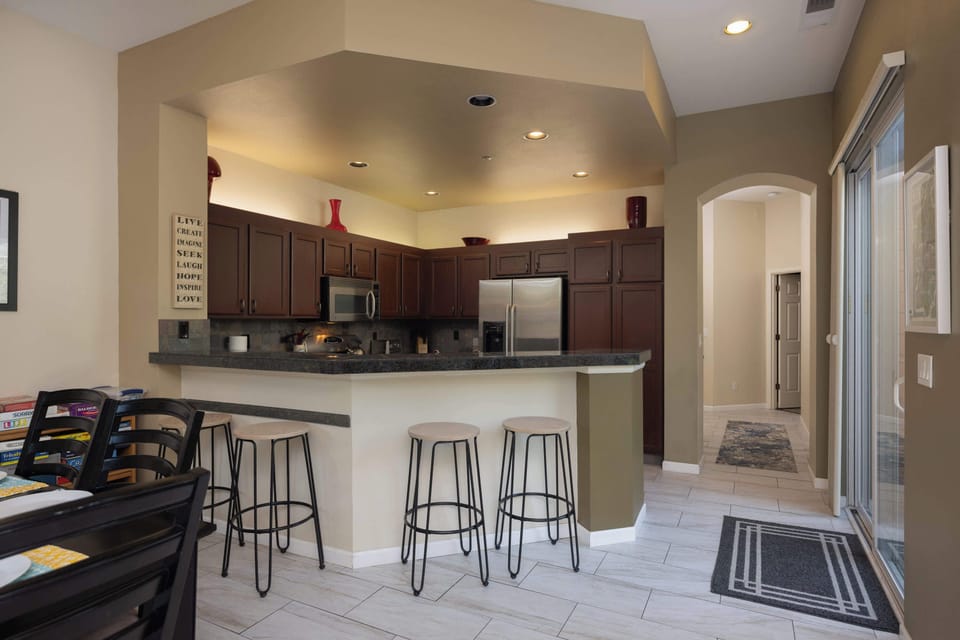 The chic, open kitchen offers ample space & every home comfort