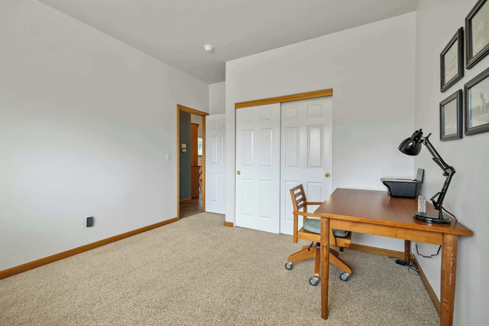 This 2nd floor bedroom offers a twin bed, twin trundle, and desk workspace