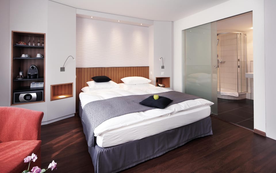 Hypo-allergenic bedding, down comforters, minibar, in-room safe