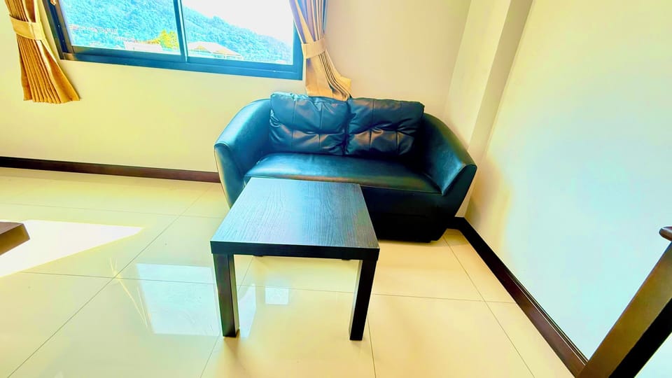 Standard Double Room, City View | Living area | 32-inch LED TV with cable channels