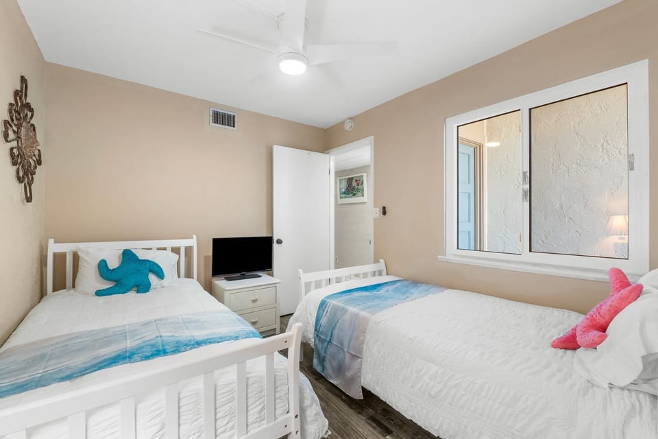 Comfortable twin bedroom with space to relax and unwind.