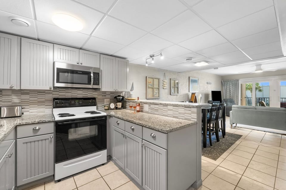 Fully equipped kitchen, cozy dining area, and open layout designed for time together.